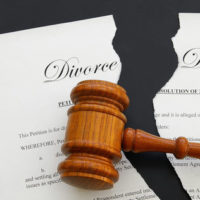 Gavel resting on divorce decree.